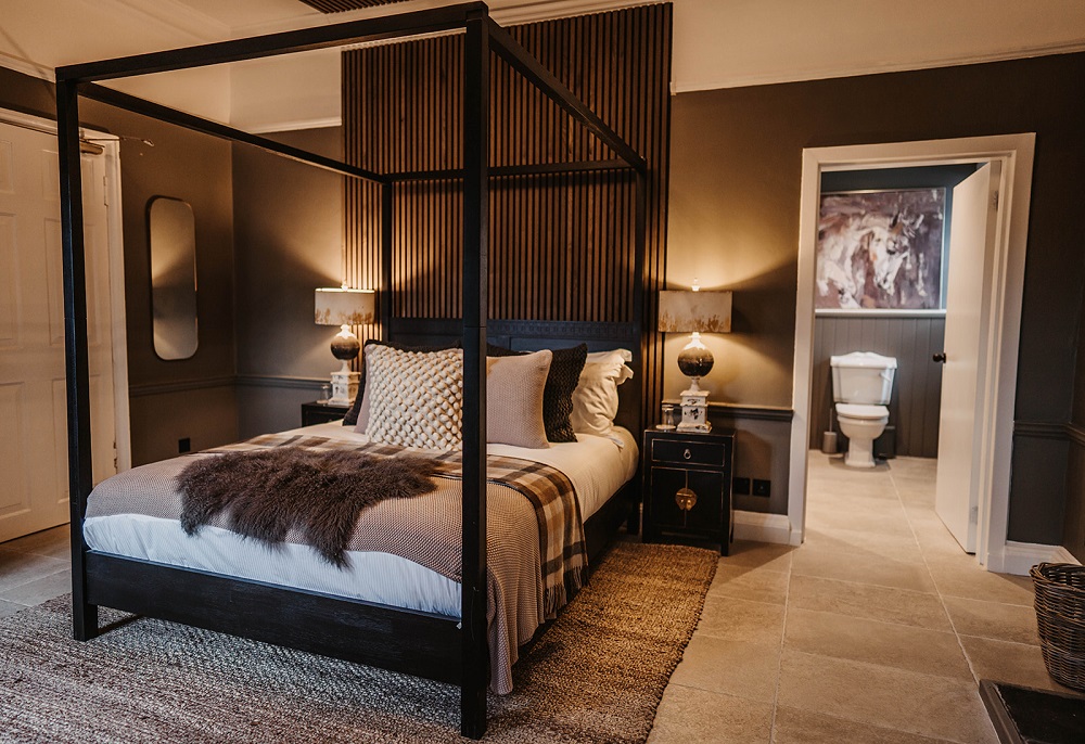 Bed, lights, furnishings and toilet in room one at The Murray Arms